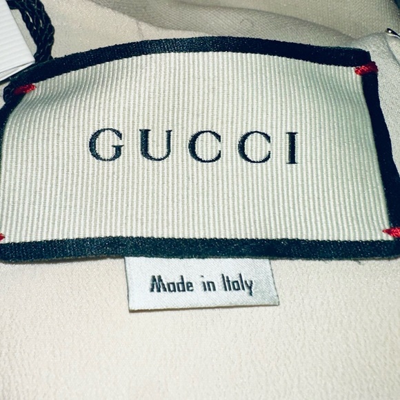 Gucci Red, Crème and Black Asymmetrical Dress with Gucci ivory dress cover. - Picture 7 of 15